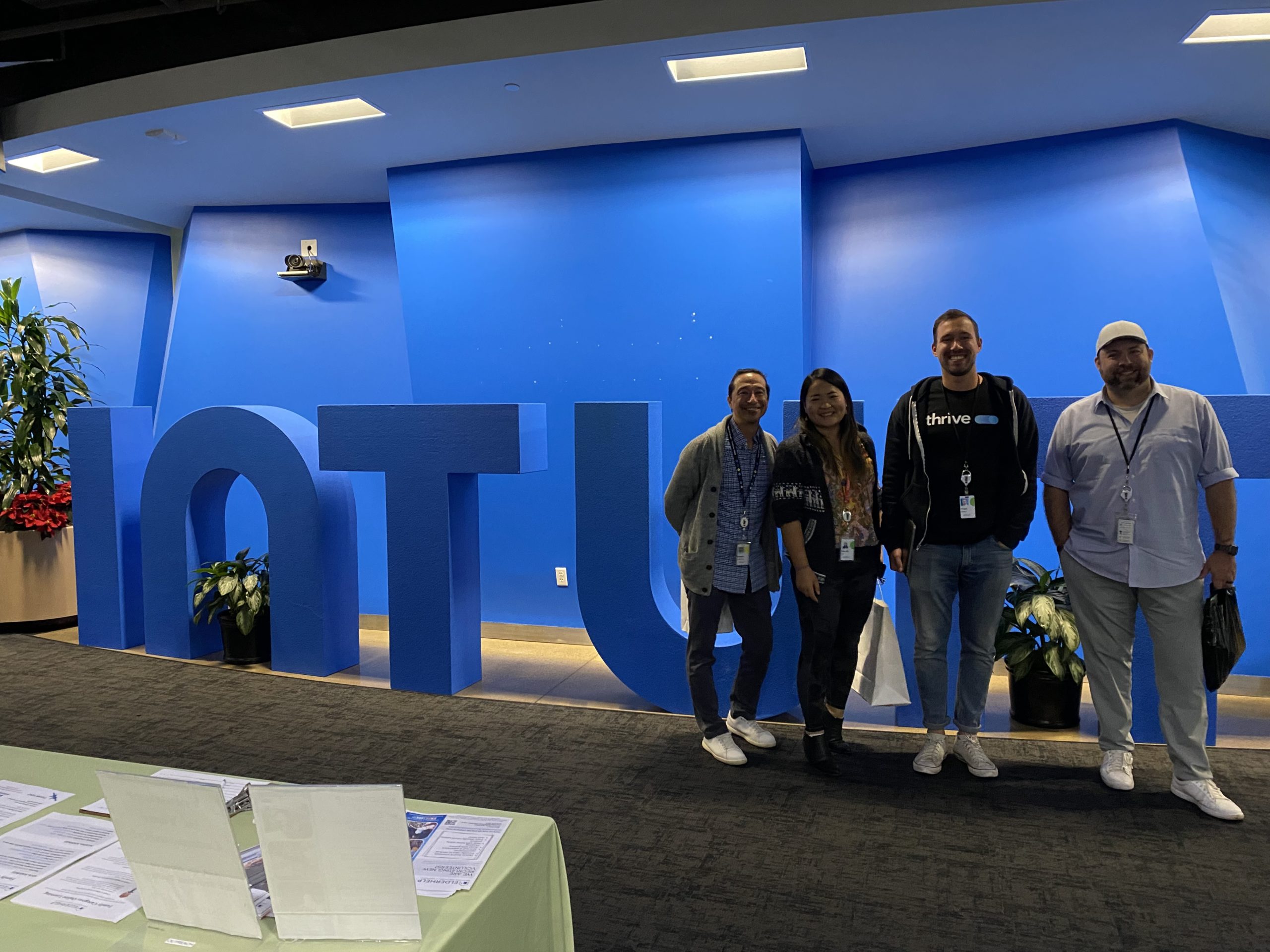 intuit team in front of sign